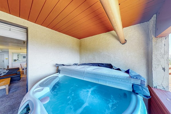 Ski-in/out condo with mountain view, private hot tub, deck & fireplace