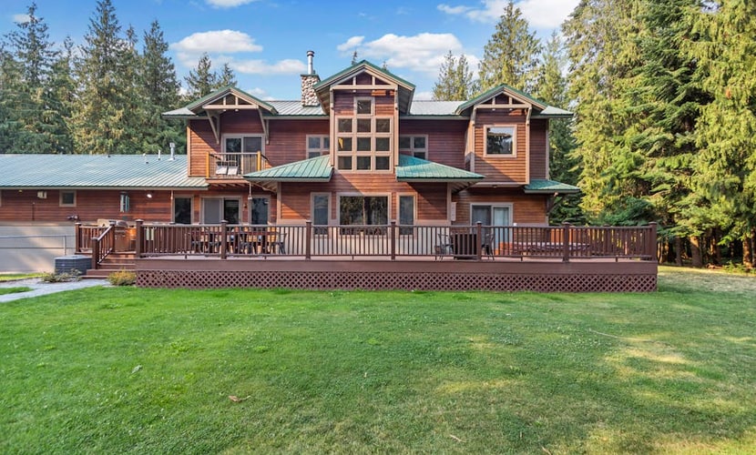 Expansive Riverfront Lodge with Dock, Game Room, Bar & Spacious Deck!