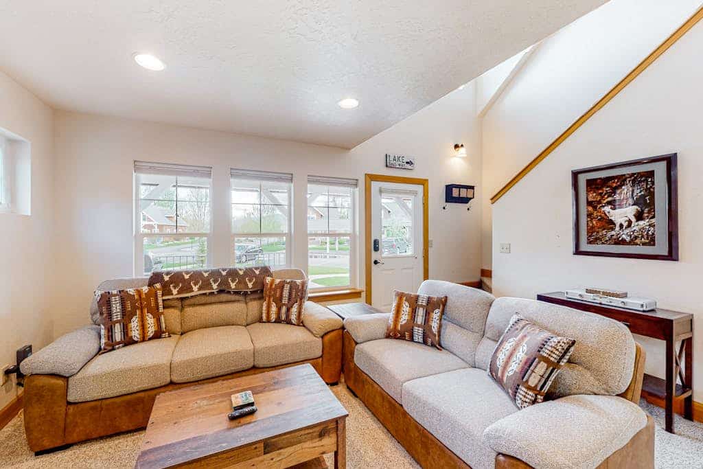 Adorable, two-story home with a furnished front porch, fireplace, & washer/dryer