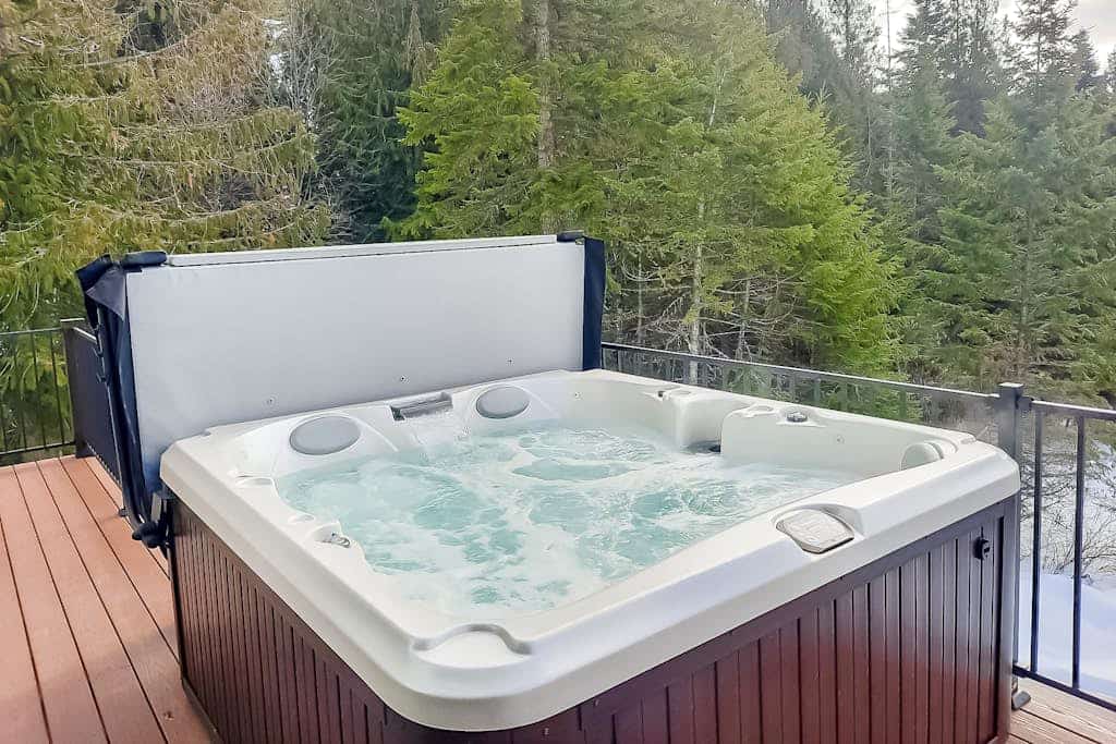 Secluded home with deck, grill, hot tub, fireplace, private beach, & W/D