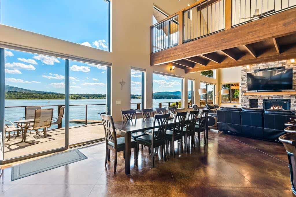 Custom riverfront home with private dock, game room, hot tub & heated floors