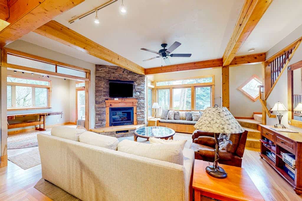 Lakefront home with mtn views, private hot tub, dock, deck, & grill