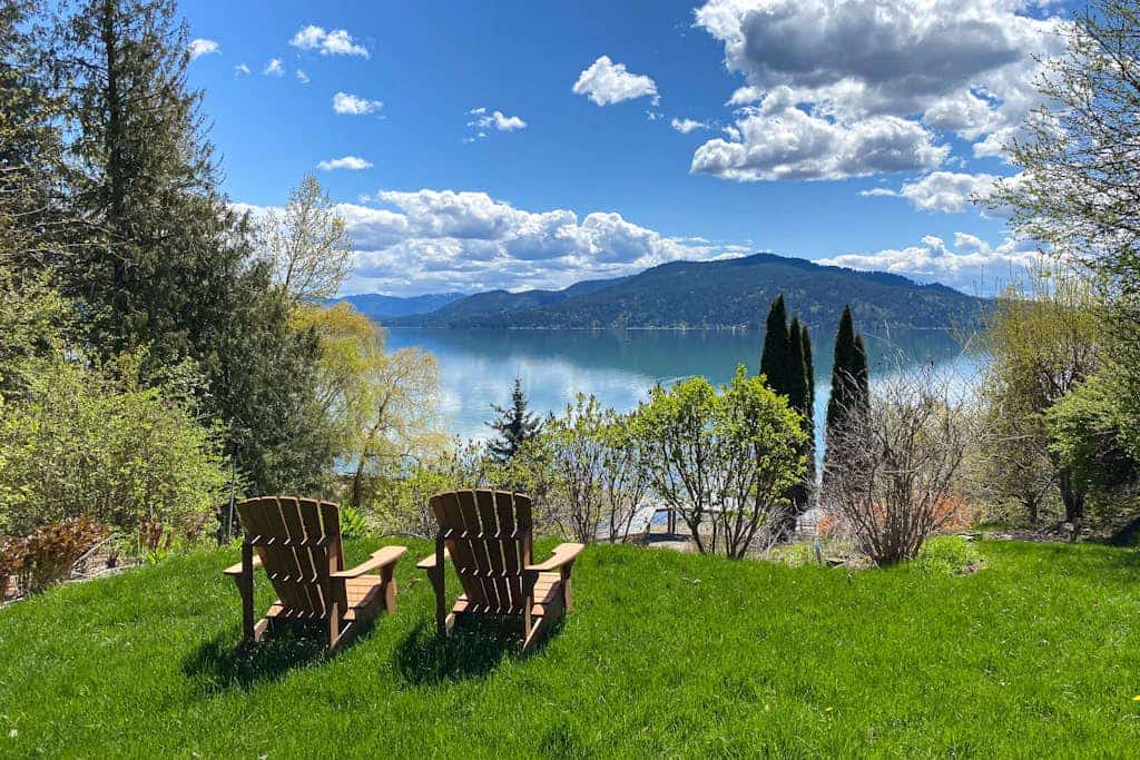 Lakefront home with mtn views, private hot tub, dock, deck, & grill