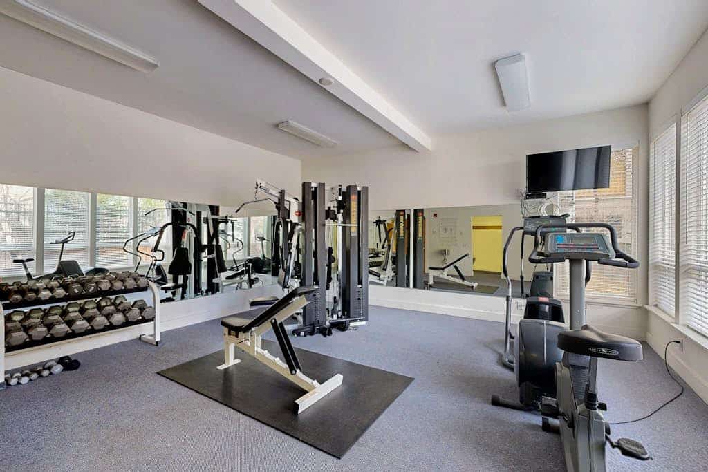 Cozy mountain-view condo with furnished deck, hot tub, & gym - walk to lifts