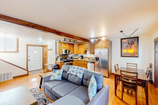 Inviting riverfront home with balcony, fireplace, skiing, W/D & dog-friendly