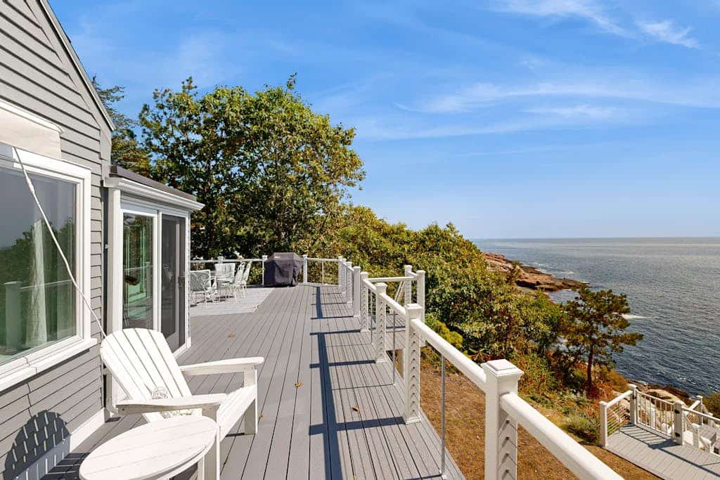 Modern oceanfront home with scenic deck, grill, games, chef's kitchen, & W/D
