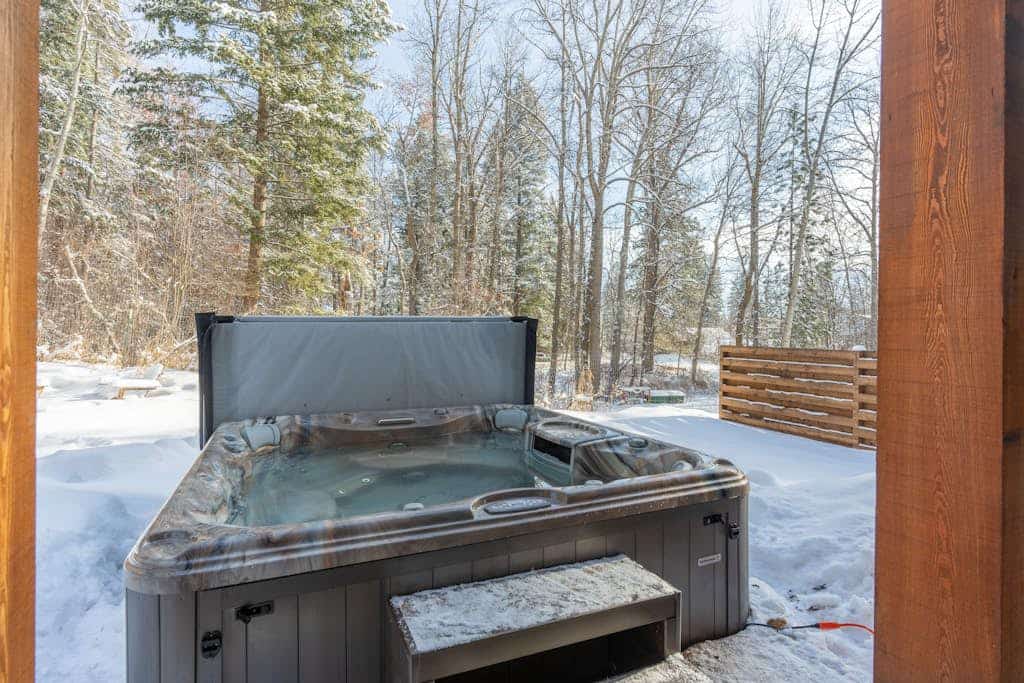 Amiable townhome with fireplace, hot tub, patio, gas grill, deck, & balcony