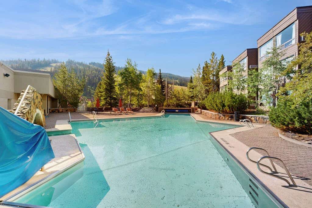 Ski-in/out condo with mountain view, hot tub, pool, & fireplace