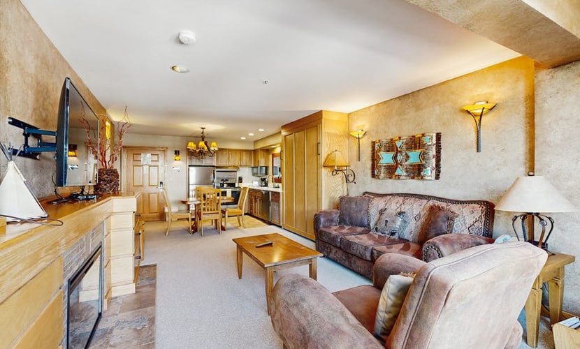 Ski-in/out condo with mountain views, pool, hot tub, sauna, gym & fireplace