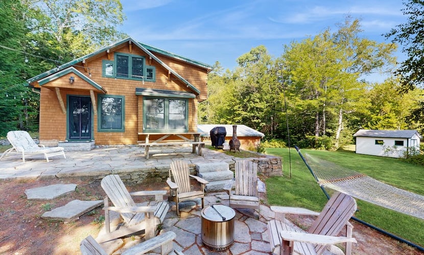 Belgrade Lakes getaway with private swim dock, outdoor living, & canoe/kayaks