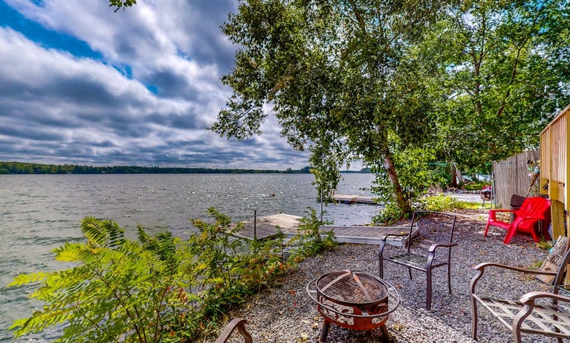 Dog-friendly lakefront home with dock, fireplace, firepit, lake views, & 1 kayak