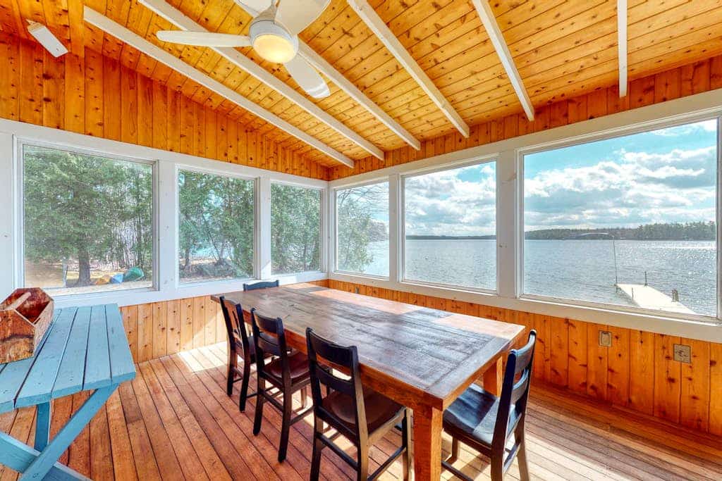 Lakefront home with private dock, kayaks, firepit, grill, & sunroom