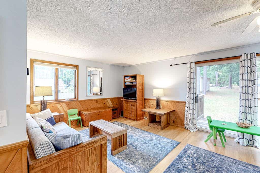 Two-story lakefront home with a seasonal dock, furnished deck, & washer/dryer