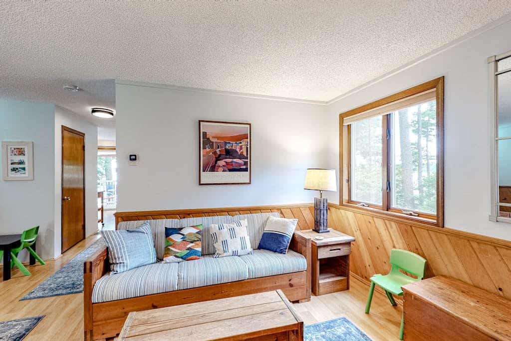 Two-story lakefront home with a seasonal dock, furnished deck, & washer/dryer
