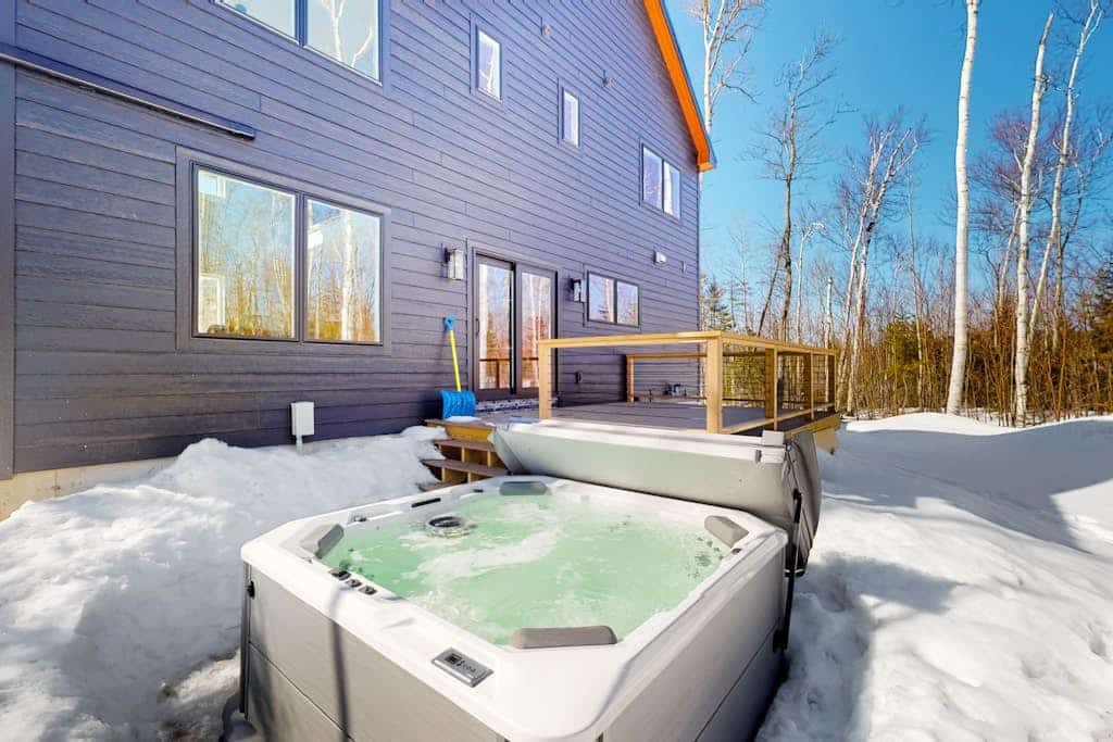 Mountain escape with a hot tub, game room, four bedrooms, & gas fireplace