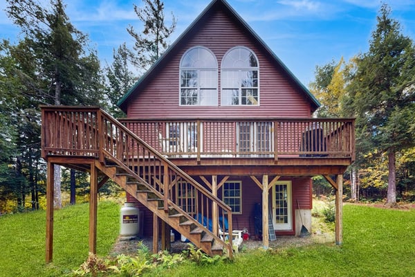 Spacious mountain house with a cozy fireplace, game room, and large deck