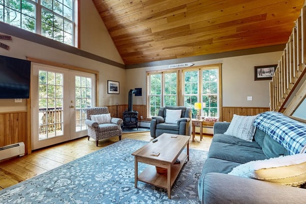Spacious mountain house with a cozy fireplace, game room, and large deck