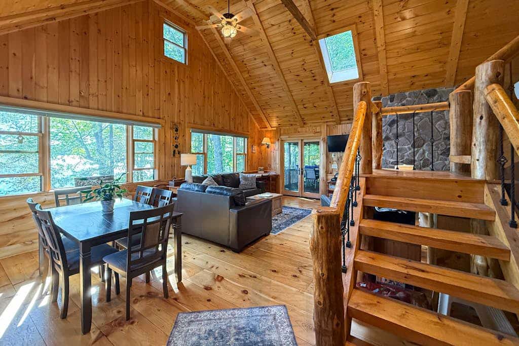 Inviting Lakeside Home with direct dock access, patio seating, and gas fireplace