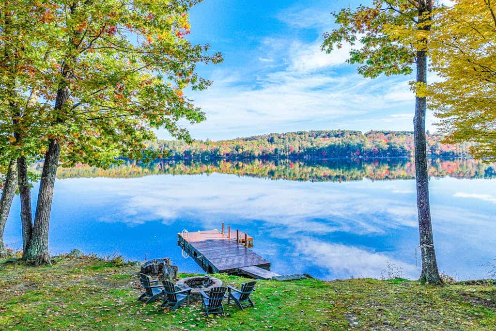 Lakefront, dog-friendly home with dock, kayaks, SUPs, canoe, huge deck & firepit