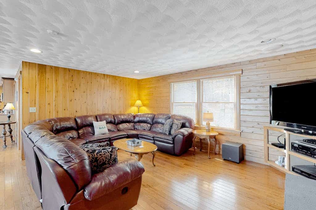 Lakefront, dog-friendly home with dock, kayaks, SUPs, canoe, huge deck & firepit