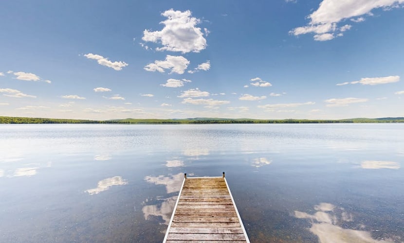 Lakefront dog friendly cottage w/ a dock & beautiful sunset views