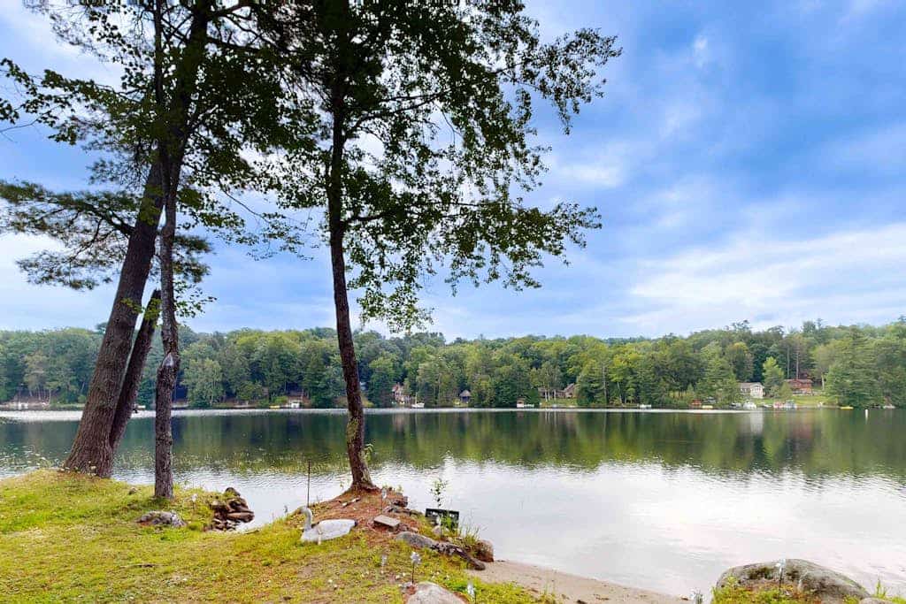 Charming apartment with waterfront access, modern comforts, and lakeside firepit