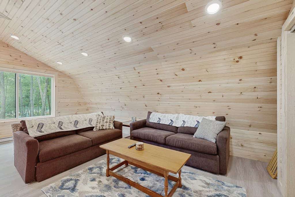 Charming apartment with waterfront access, modern comforts, and lakeside firepit