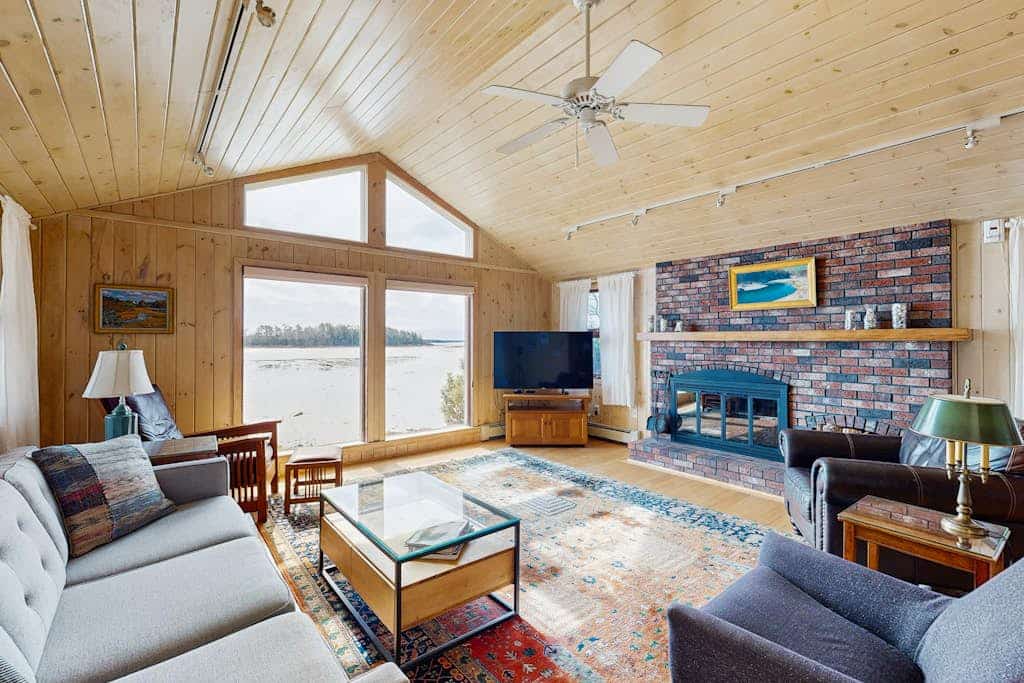 Waterfront home with furnished deck, ocean views, & full kitchen