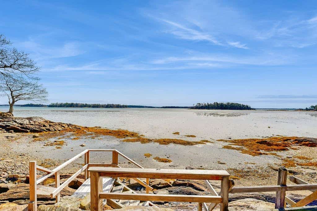 Waterfront home with furnished deck, ocean views, & full kitchen
