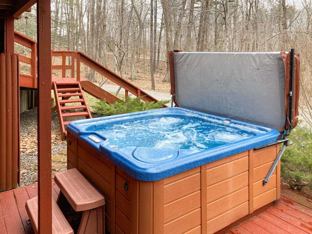 Charming Hillside Retreat with Hot Tub, Firepit, and Spacious Deck
