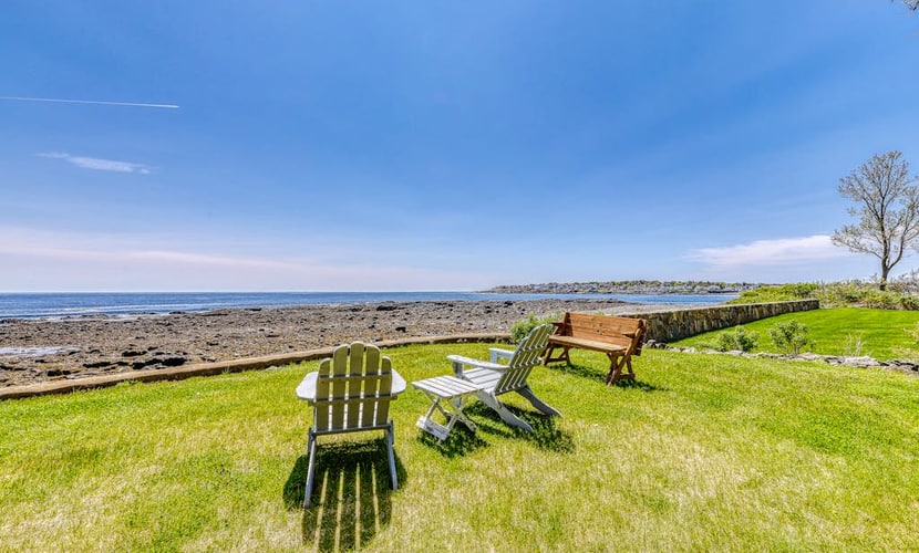 Inviting oceanfront home with fireplace, firepit, & views from every room