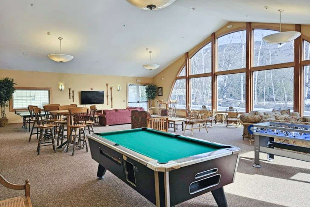Mountainside condo w/ pool & rec room:  walk to ski lifts & town