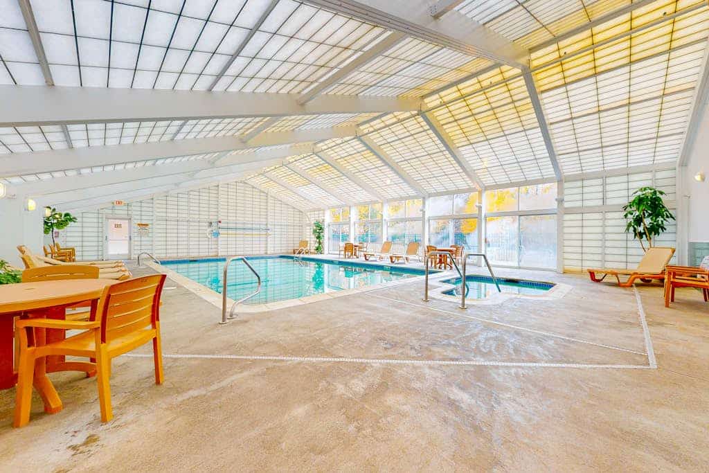 Mountain & river view condo w/ pool, hot tub, game room & walk to ski lift