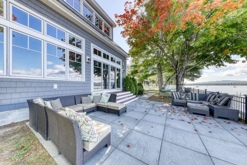 Dog-friendly lakefront home with lake views, firepit, dock, patio, & grill