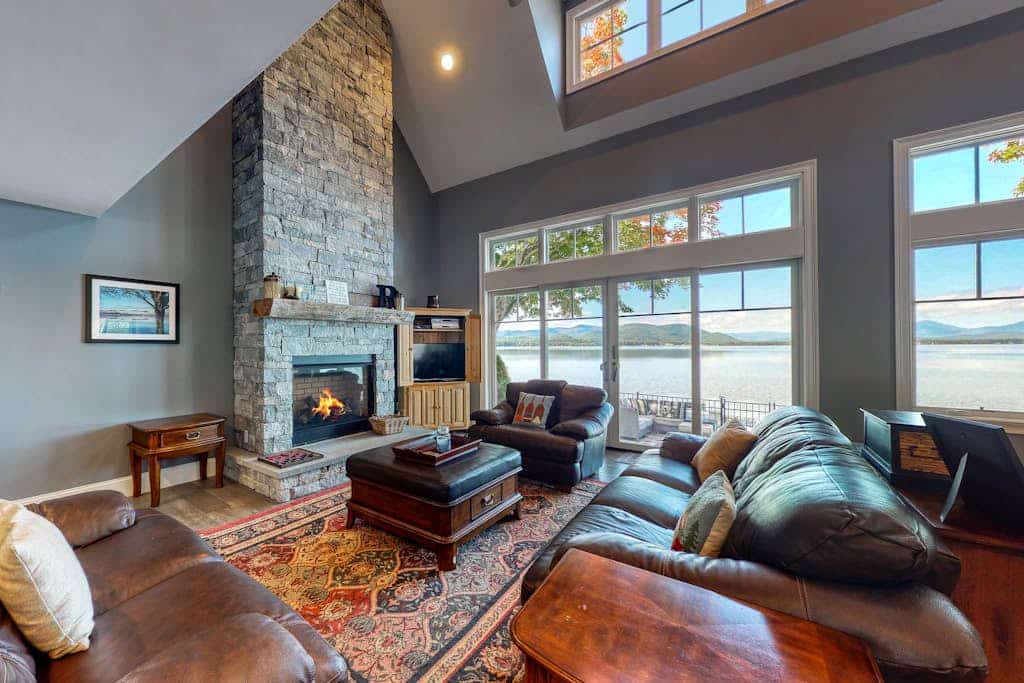 Dog-friendly lakefront home with lake views, firepit, dock, patio, & grill