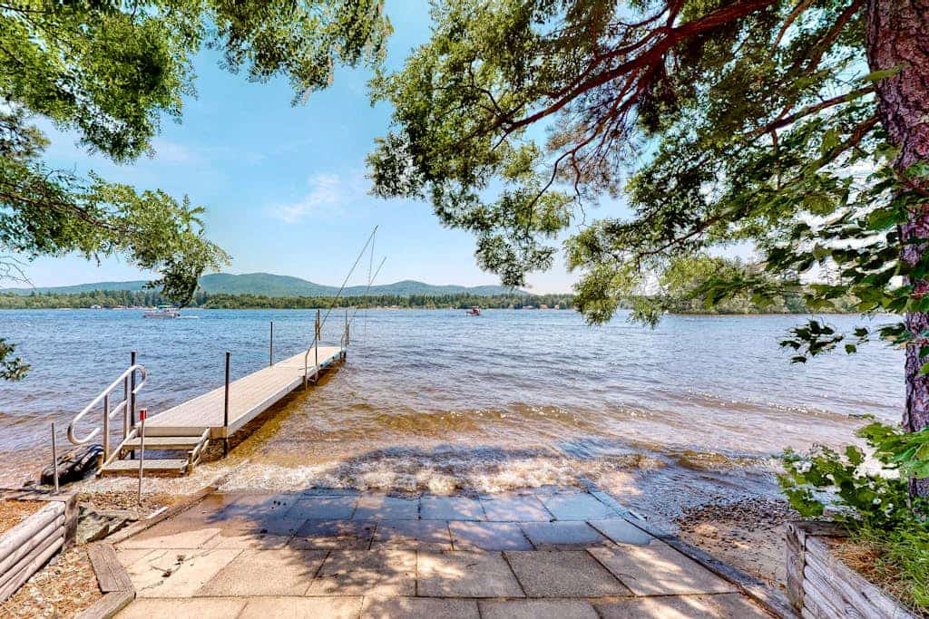 Homey lakeside property w/ one house, two cottages, mtn. views, & private beach