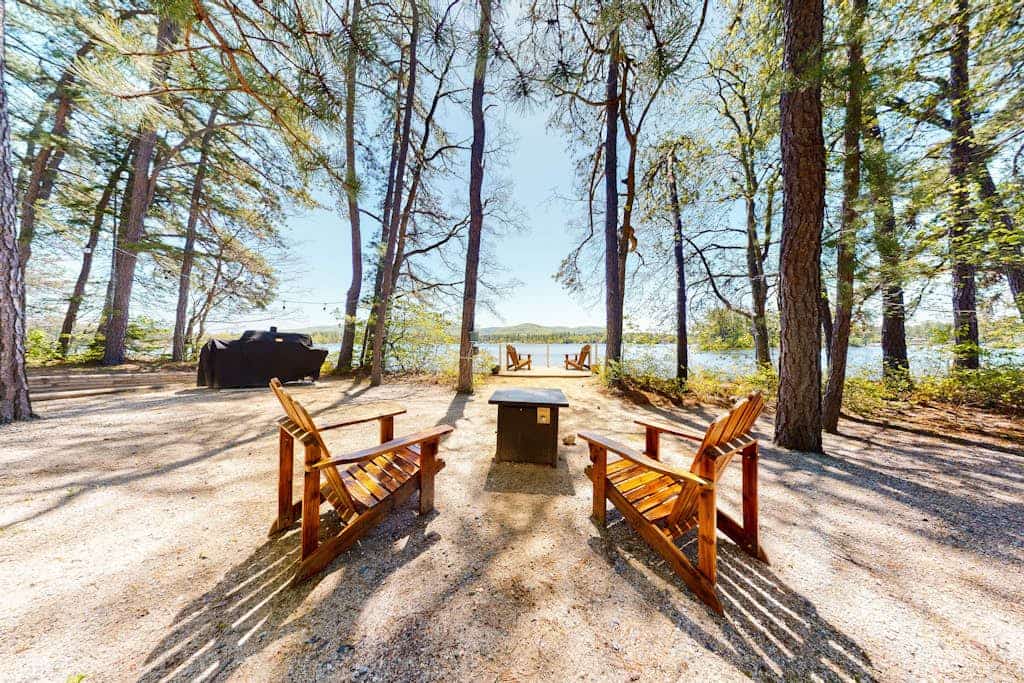 Homey lakeside property w/ one house, two cottages, mtn. views, & private beach
