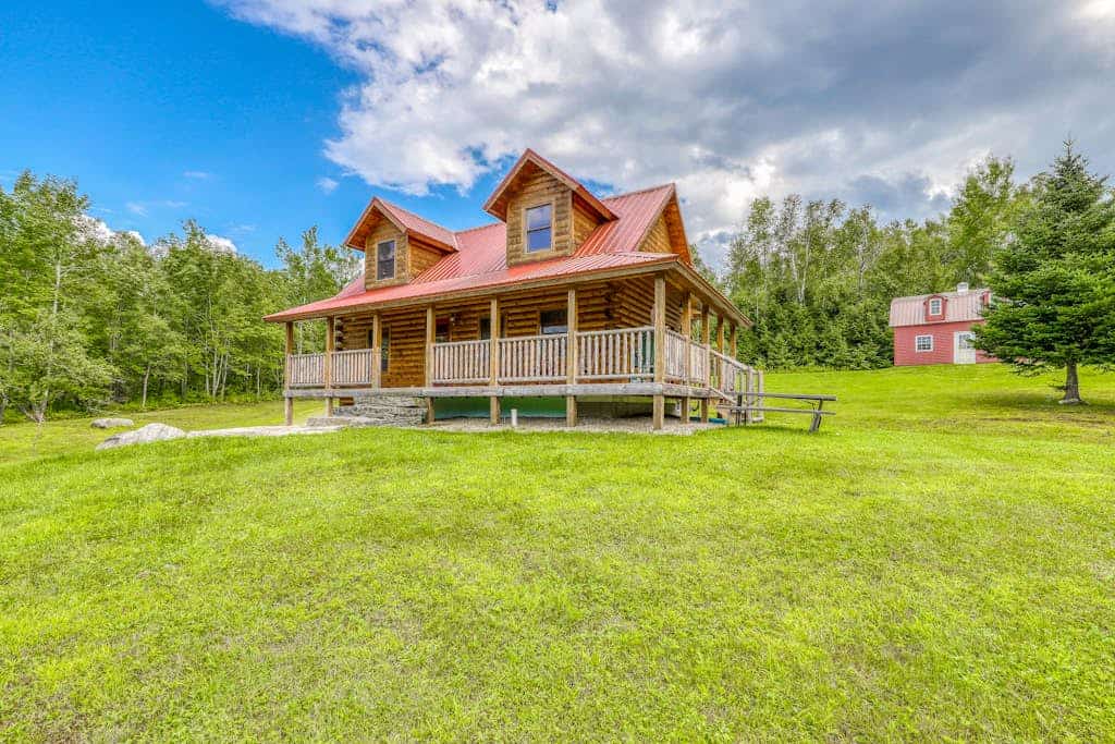 Bright three-level home with water views, jetted tub, firepit, and pool table