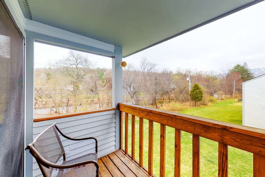 Condo with balcony views, wood-burning fireplace and community pool