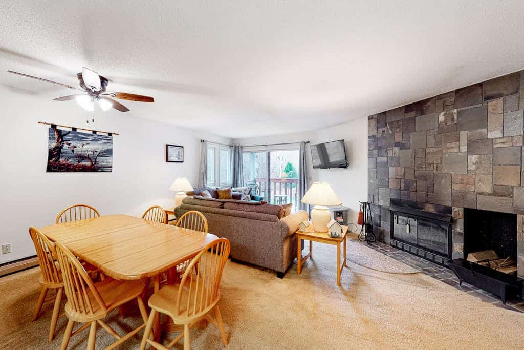 Condo with balcony views, wood-burning fireplace and community pool
