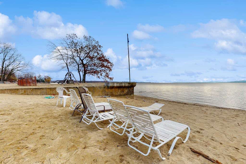 Lakefront home with water access, views of the mountains, private deck & patio