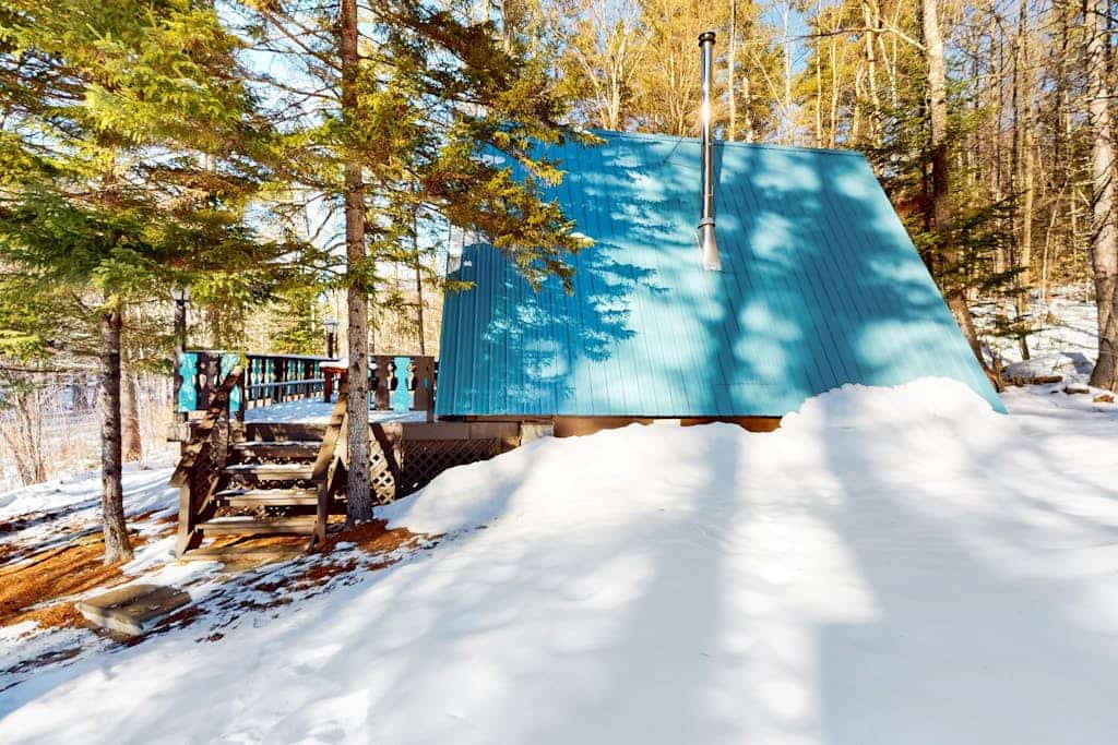 Charming gingerbread A-frame situated on 3 acres, woodstove, A/C, deck