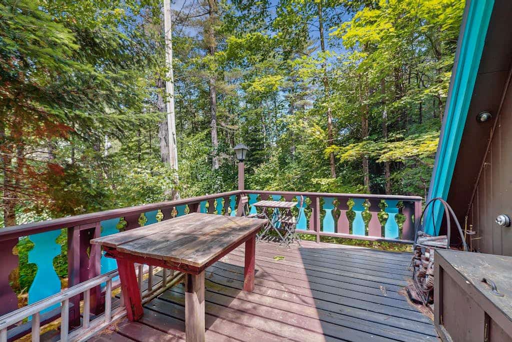 Charming gingerbread A-frame situated on 3 acres, woodstove, A/C, deck