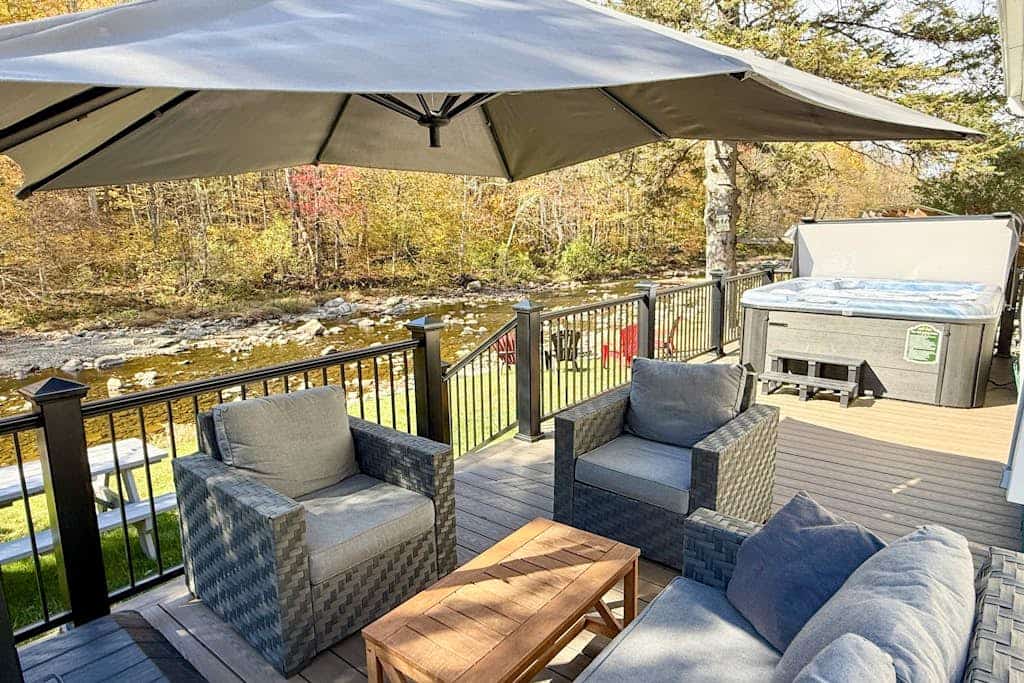 Inviting riverfront home with hot tub on deck & fireplace, near skiing & golf