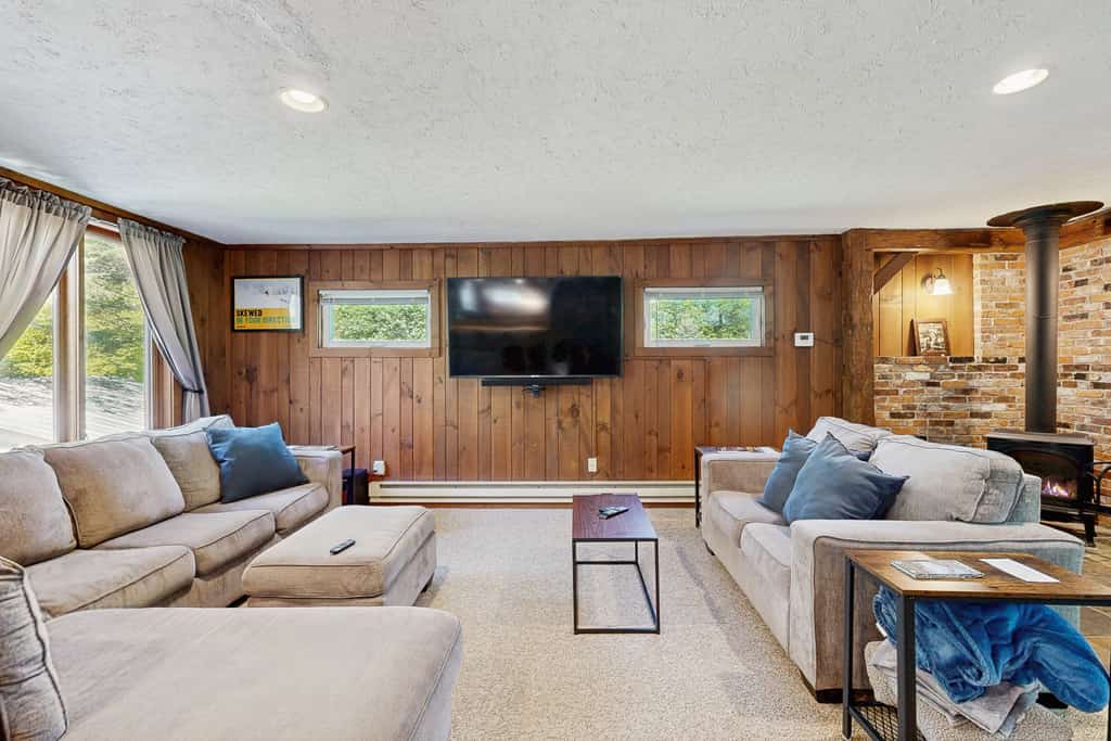 Inviting riverfront home with hot tub on deck & fireplace, near skiing & golf