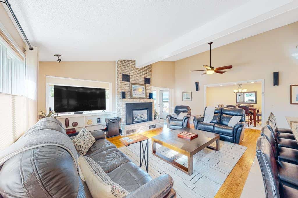 Lakefront home with pool, beach access, central AC, washer/dryer, & fireplace