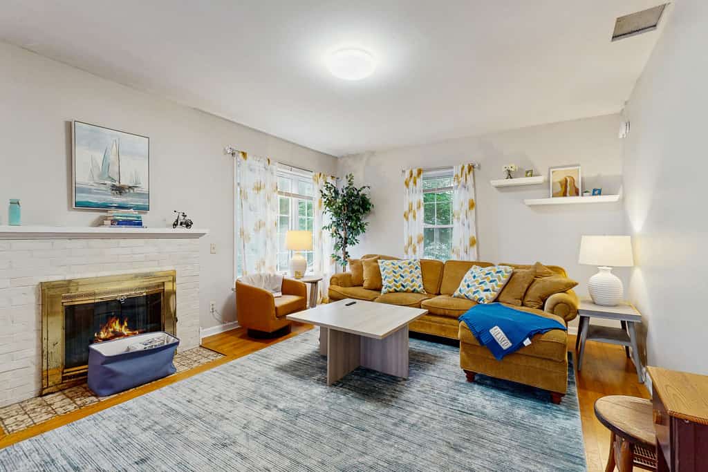 Warm & inviting retreat with a full kitchen, gas fireplace, & furnished patio