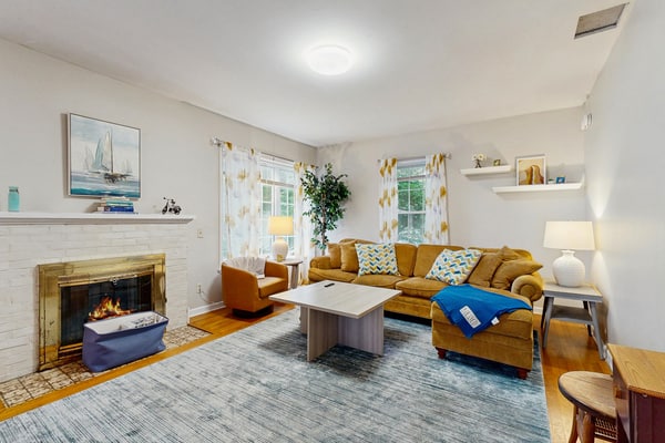 Warm & inviting retreat with a full kitchen, gas fireplace, & furnished patio