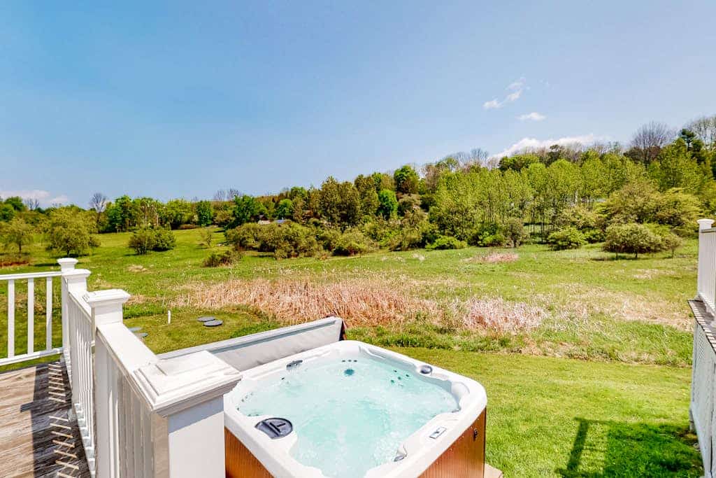Enchanting farmhouse with a hot tub, grill, children's items, & mountain views
