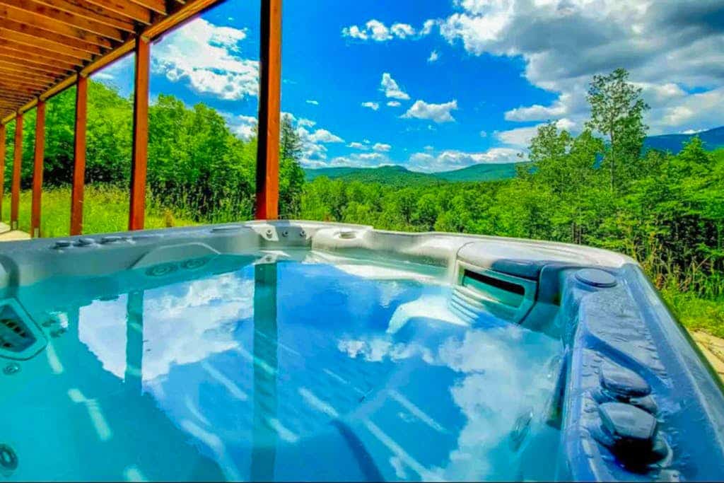 Luxury home w/ two master suites, hot tub, spectacular views, 13 private acres